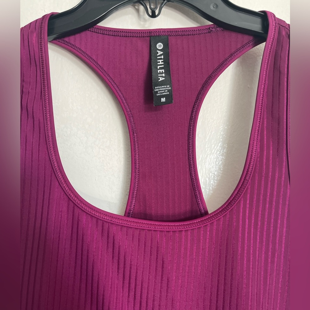 Athleta plum colored tank with zip pocket in back, in perfect condition